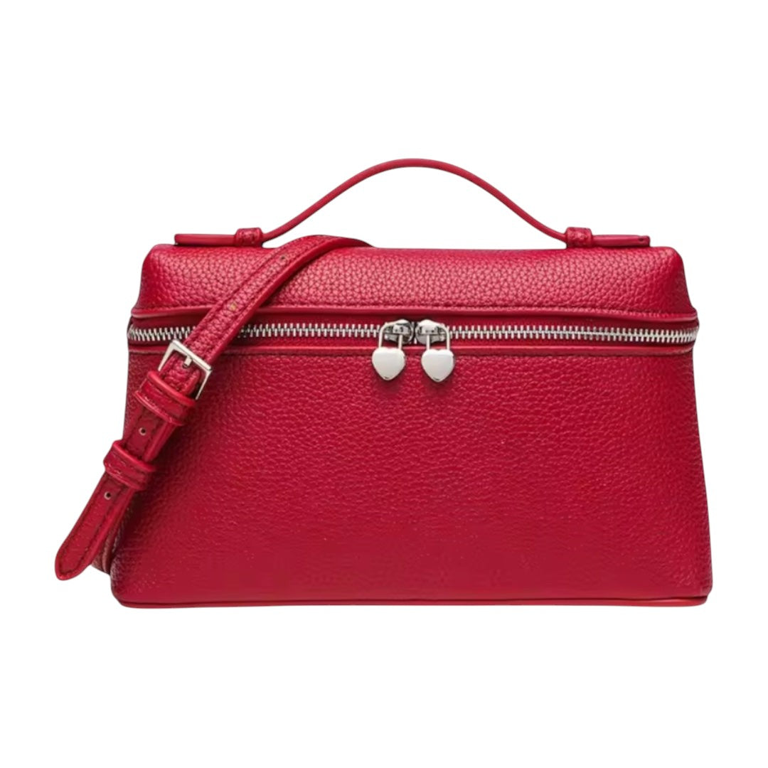 Lala Collection red Italian leather mini bag with a top handle, adjustable shoulder strap, and heart-shaped zippers.