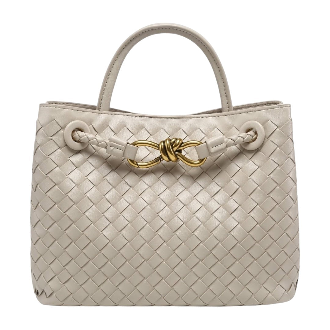 Lala Collection beige vegan leather handbag with hand-woven texture, top handle, and elegant gold knot hardware.