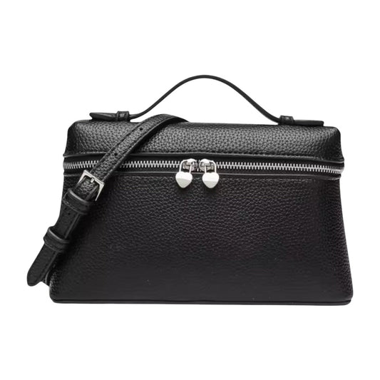 Lala Collection black leather mini bag with top handle, adjustable shoulder strap, and heart-shaped zipper pulls.