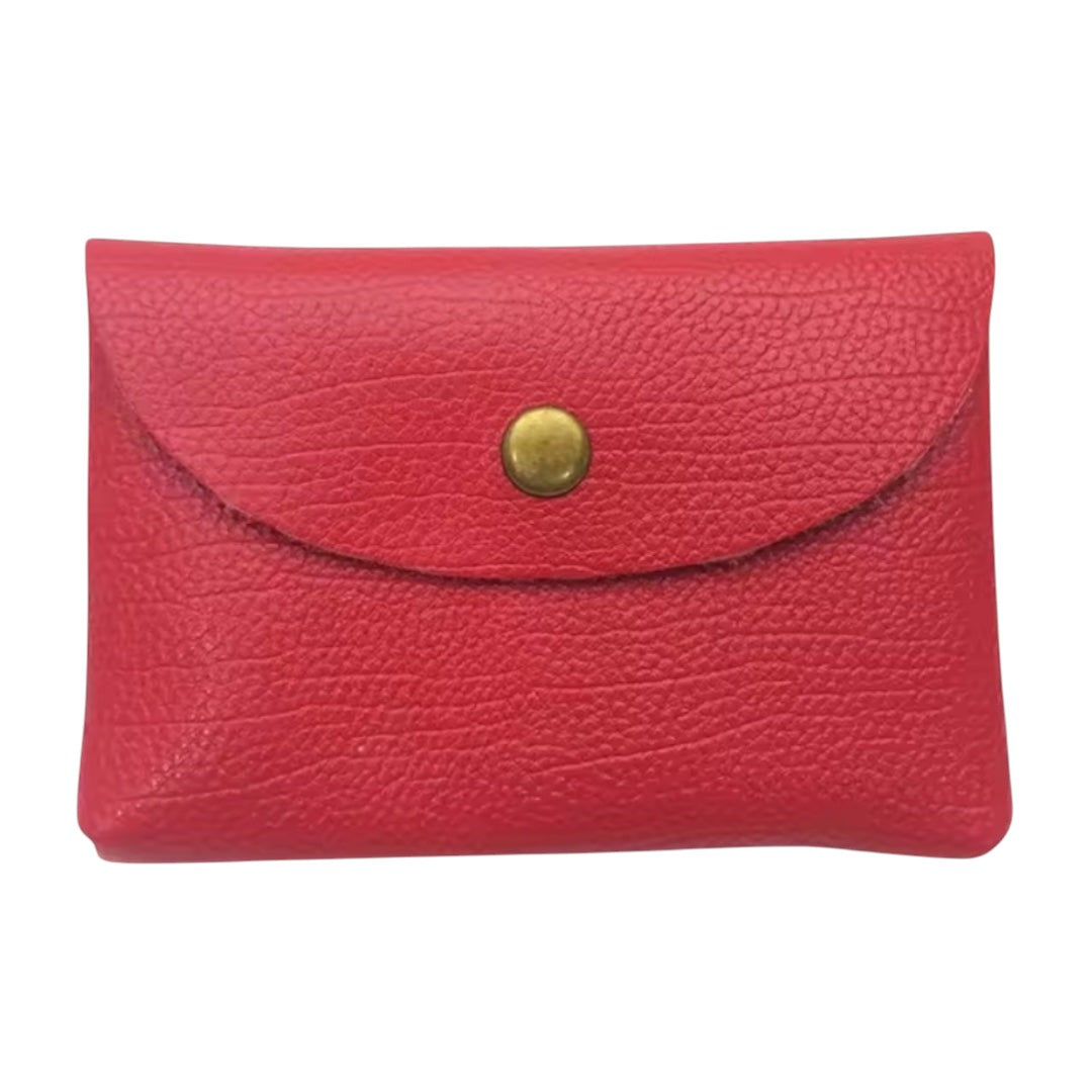 Lala Collection red genuine bovine leather card holder with a gold-tone button closure on a soft pink background.