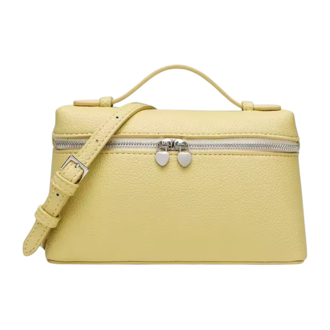 Lala Collection yellow leather mini bag with top handle, adjustable shoulder strap, and heart-shaped zipper pulls.